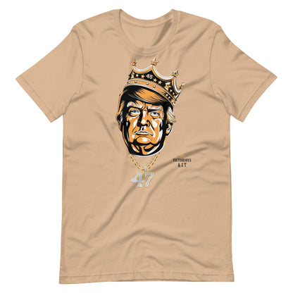 Tan t-shirt with a graphic of DJT wearing a crown and number 47 on a white background